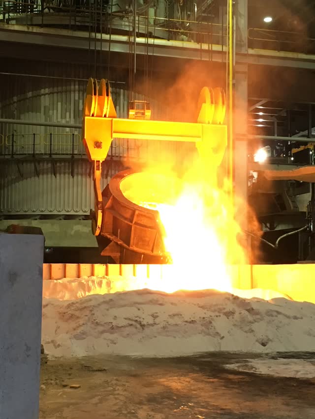 Overhead crane handling a ladle of molten metal at Sakura Ferroalloys