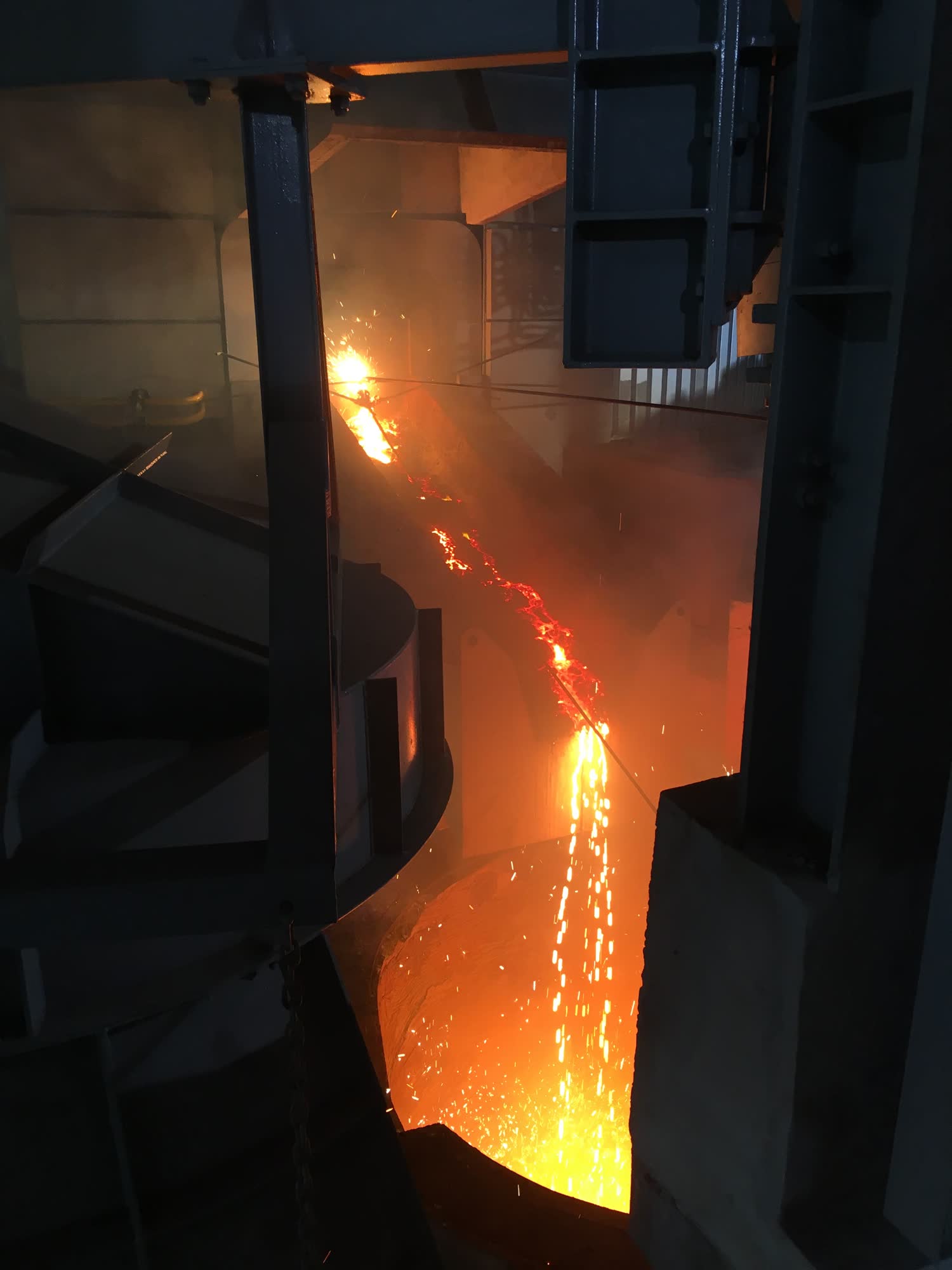 Molten high carbon ferro-manganese being tapped from a submerged-arc furnace at Sakura Ferroalloys